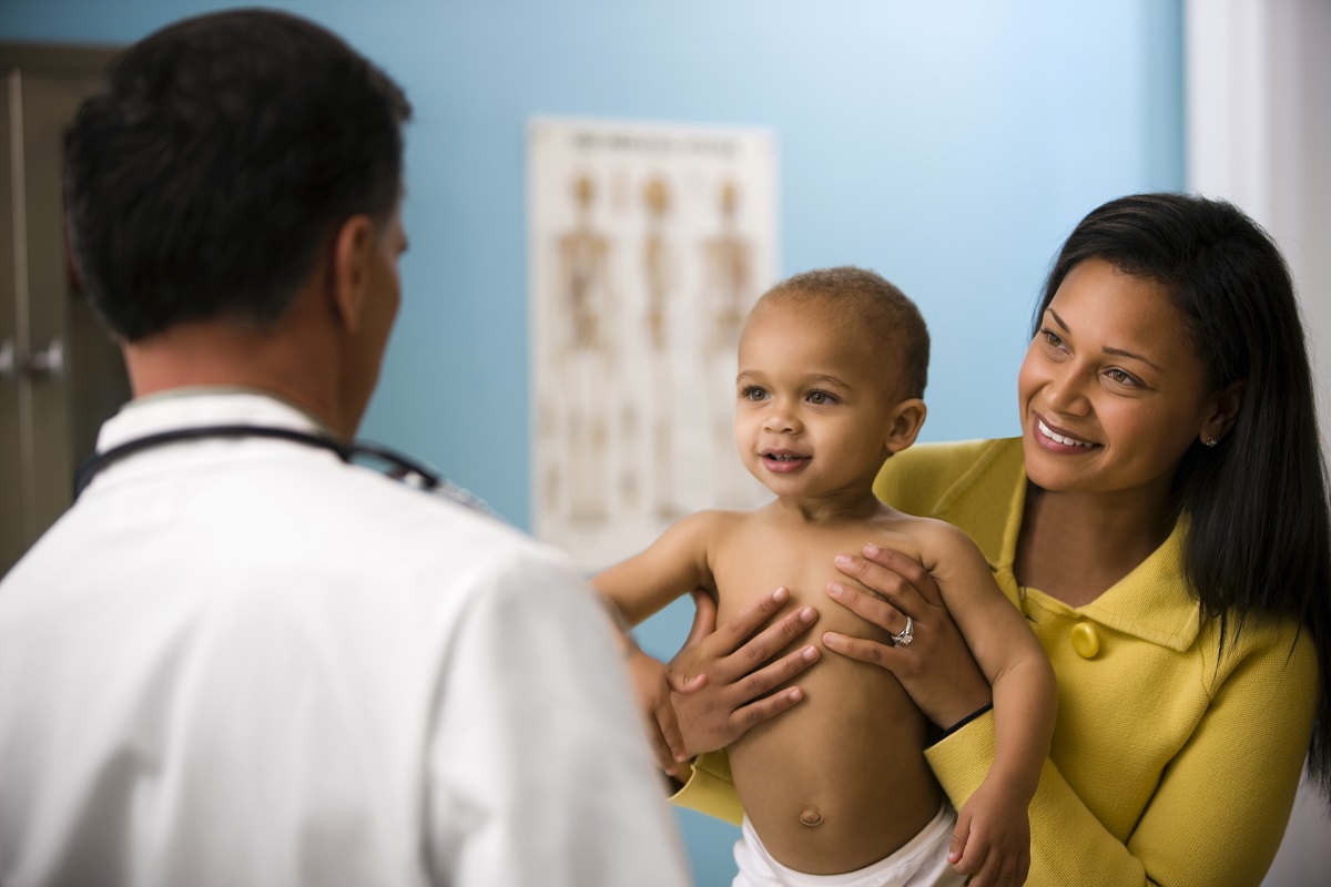 Baby in Diaper with Mother and Doctor