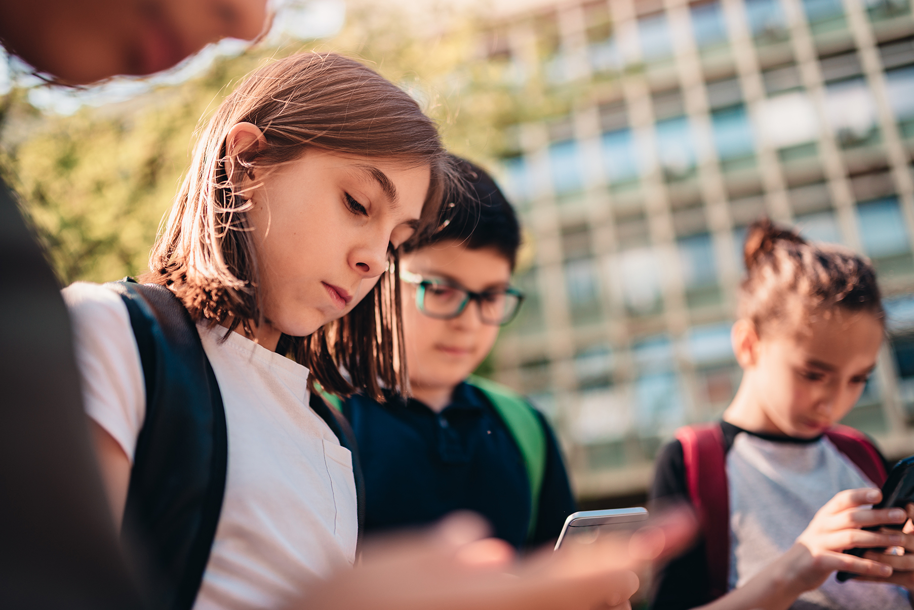 Group of friends hang out after school and using smart phone