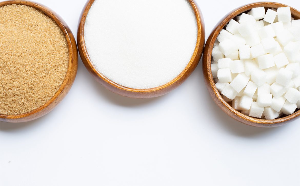 Various types of sugar on white