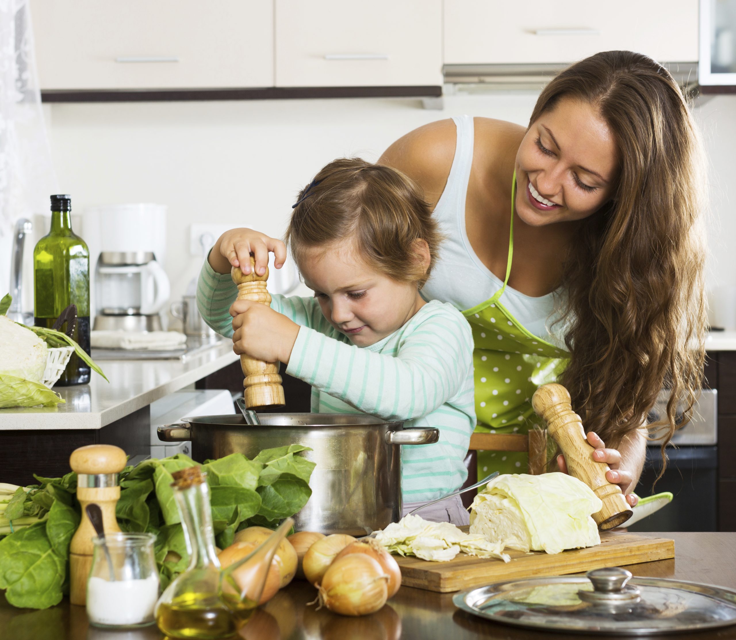 Happy family cooking  soup